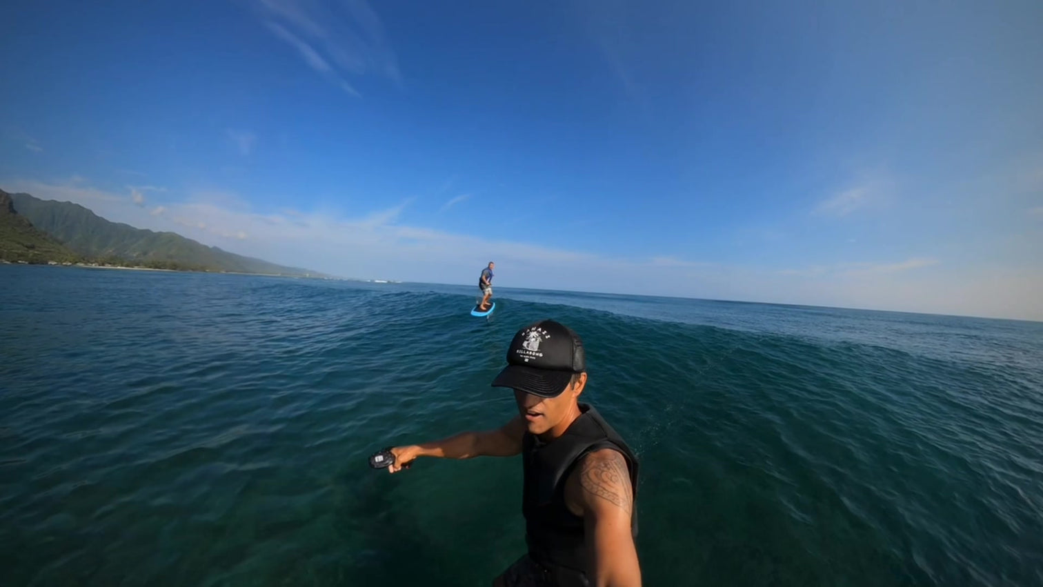 open_ocean_fun_1512x a man standing next to a body of water